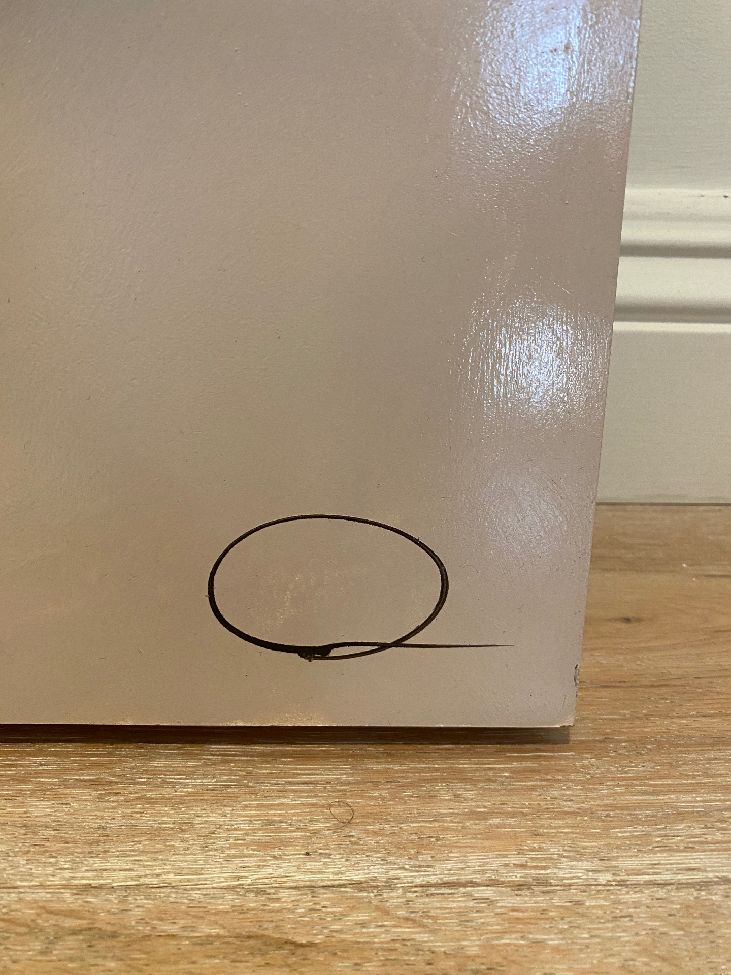 The artist's signature on the lower right of the panel